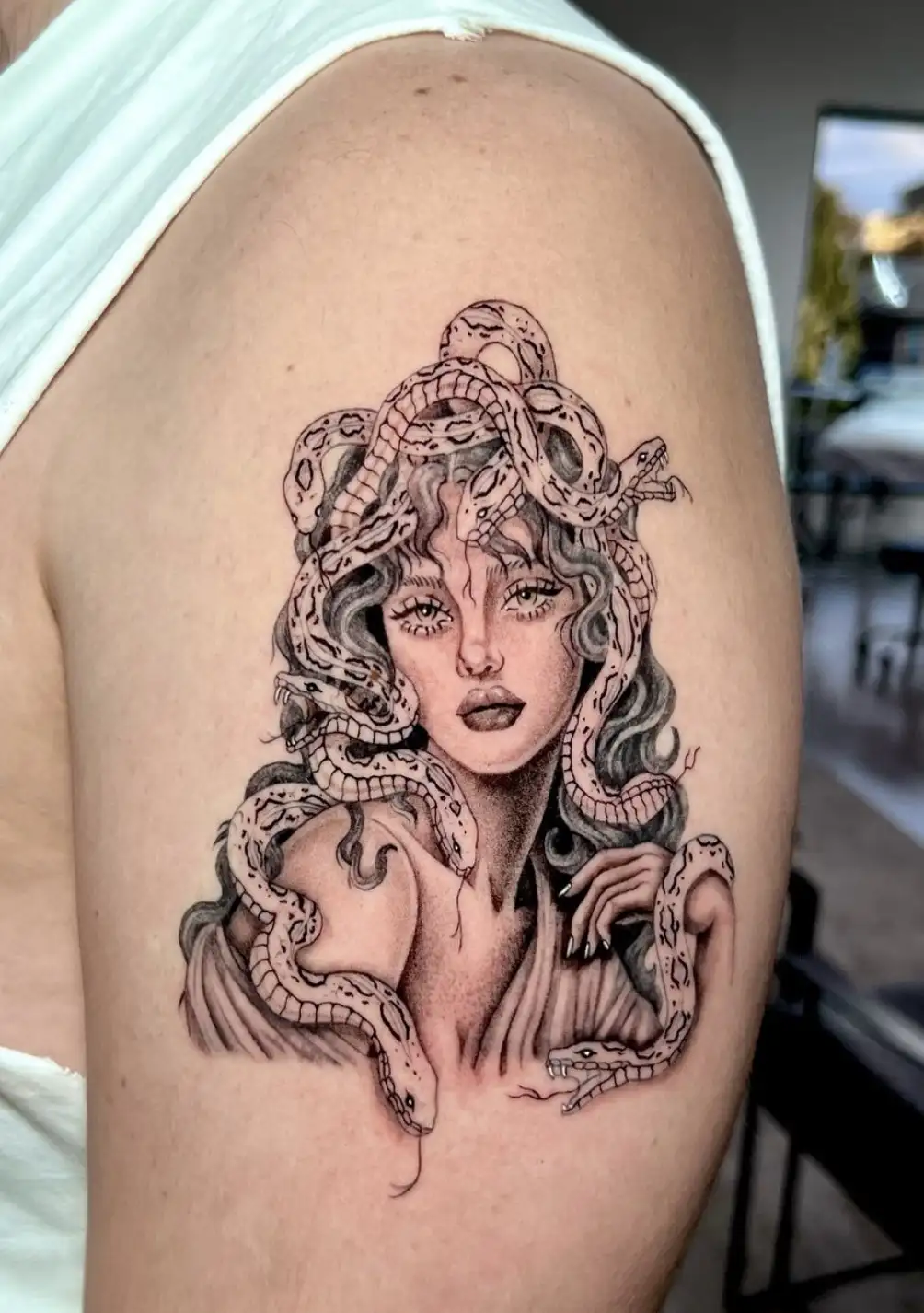 Ornamental medallion tattoo with intricate patterns on arm by Ayah at Omnia Tattoo Melbourne